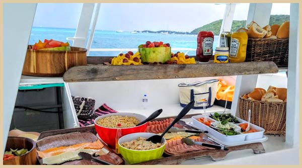 Snack bar with fresh fruit, cold cots and cold drinks on the Fun Cat Catamaran Puerto Rico at Icacos Puerto Rico