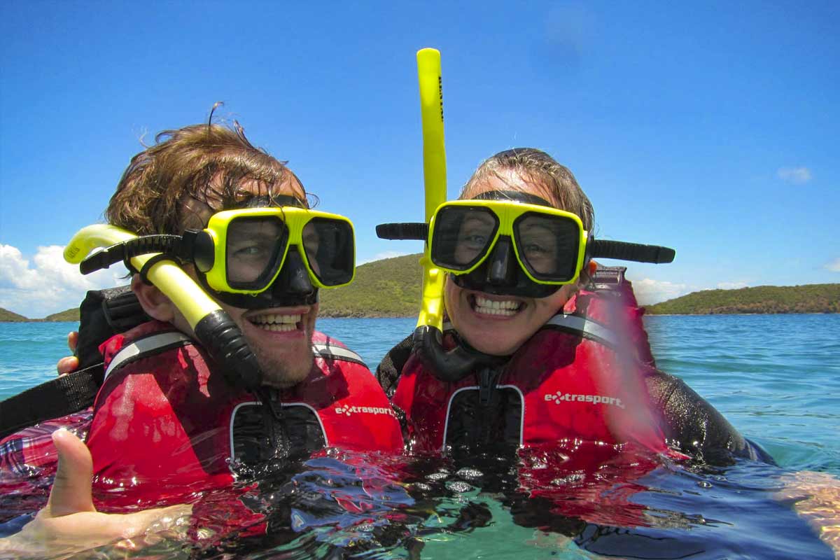 Man and woman smile while snorkeling in culebra with Kayaking Puerto Rico culebra snorkeling tour