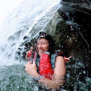 Standing under a falling water. Fun Things to Do in Puerto Rico