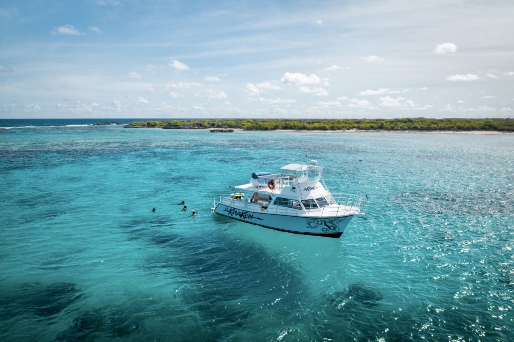  Icacos island snorkeling, tourists swim near the Yacht Kraken