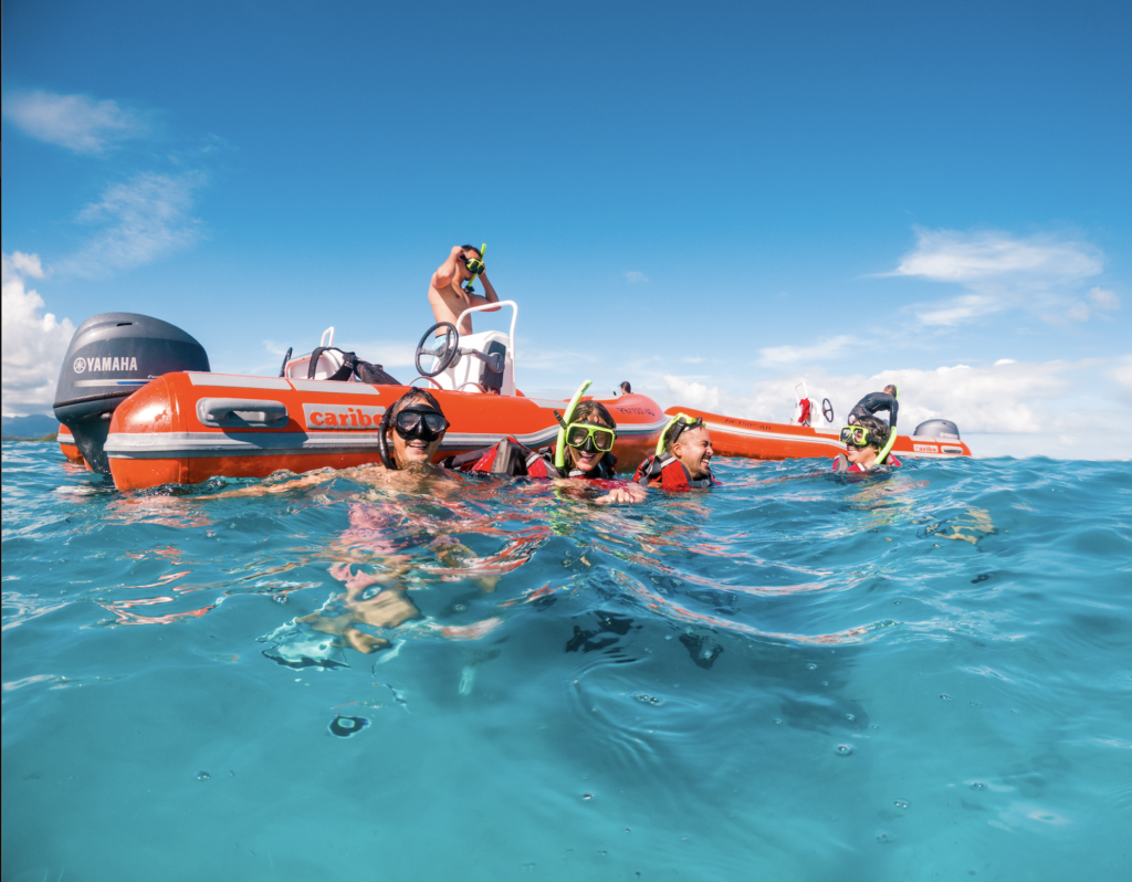 A group of people having fun during a mini boat adventure