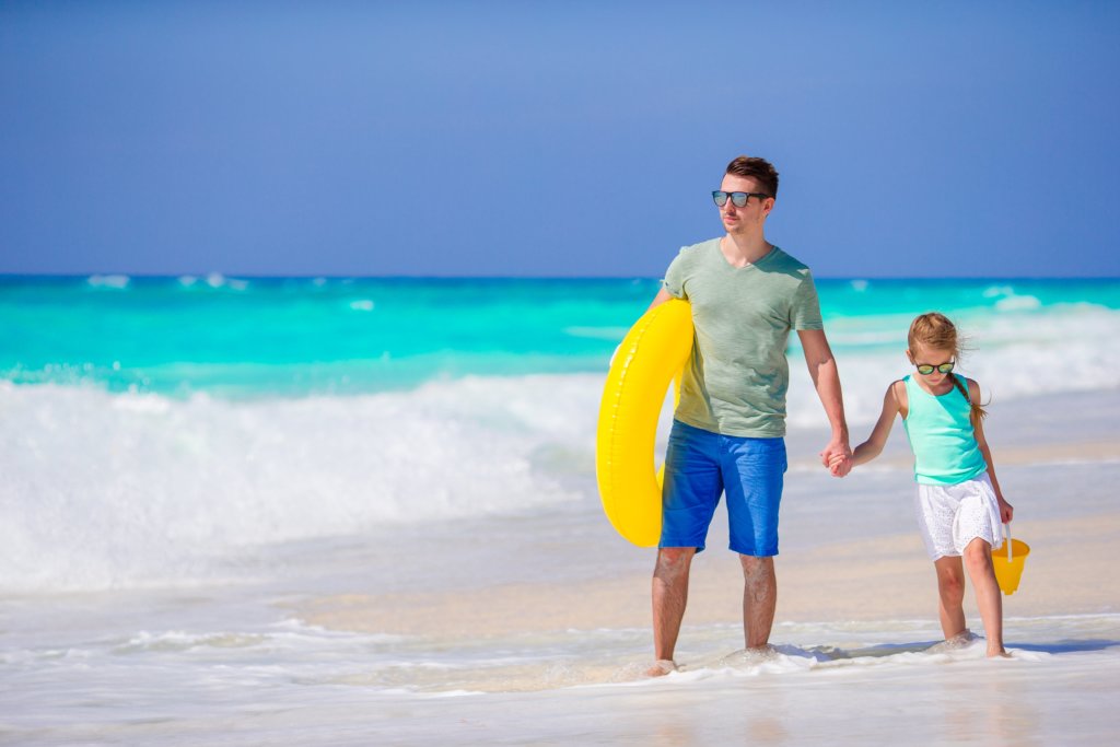 Dad and daughter on the beach