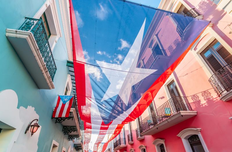 Large flag of Puerto Rico above the street in the city center of San Juan